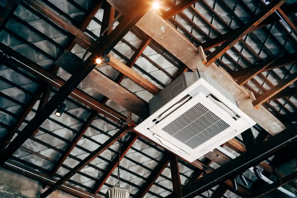 Ceiling cassette air conditioner installed under a metal roof