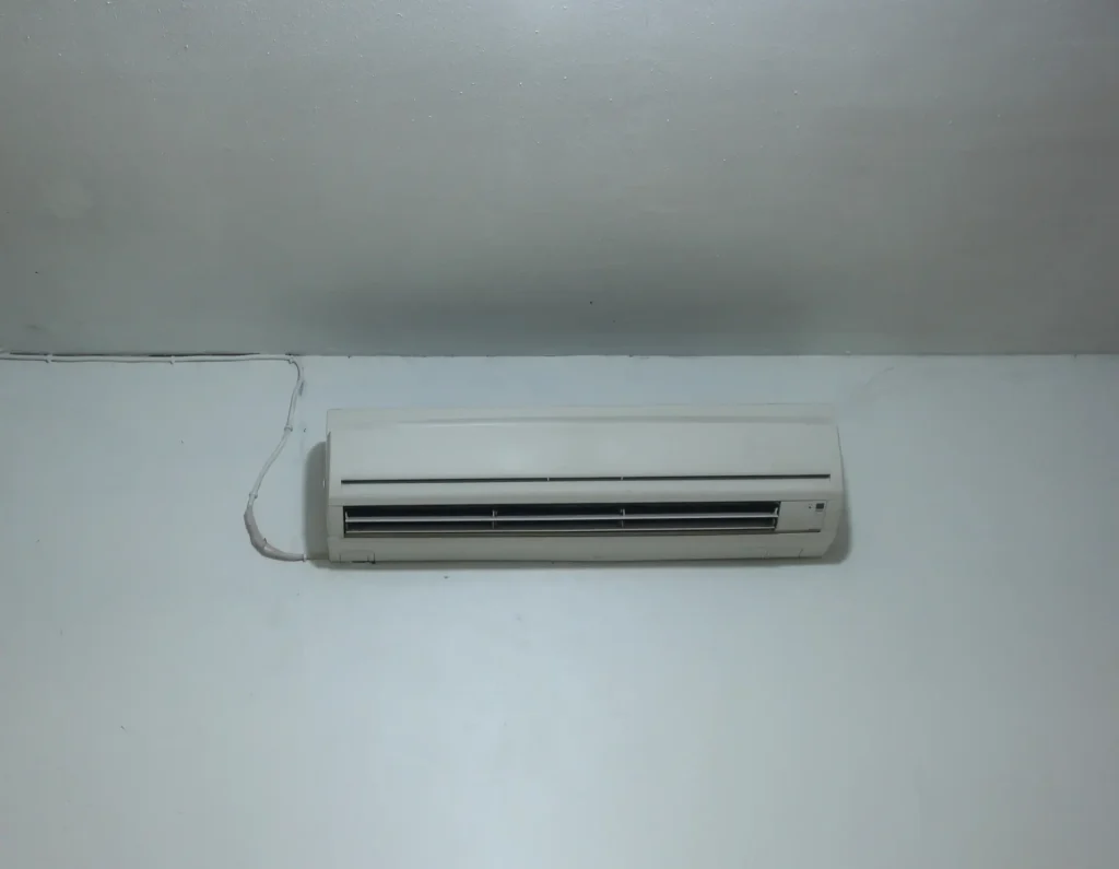 White wall mounted AC unit in a room
