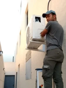 ac technician is repairing the split ac in riyadh